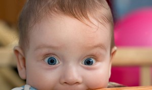 HD-Funny-Baby-having-Table-in-his-Mouth